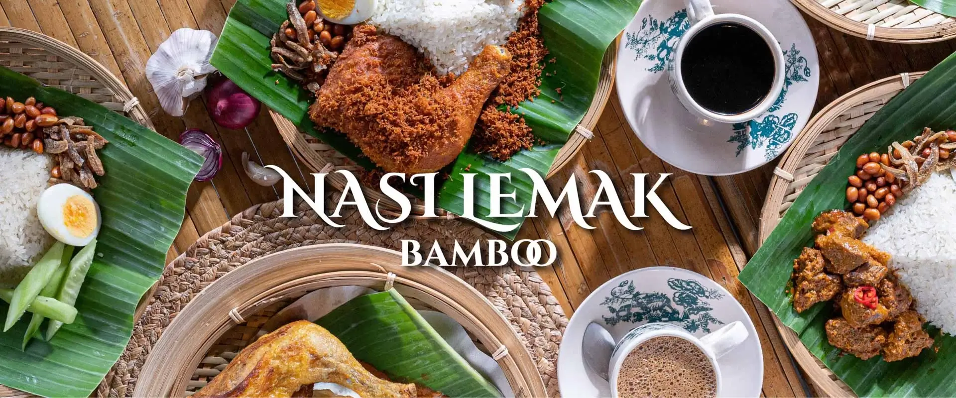 Nasi Lemak Bamboo presentation with fried chicken, rice, nuts and a traditional coffee service