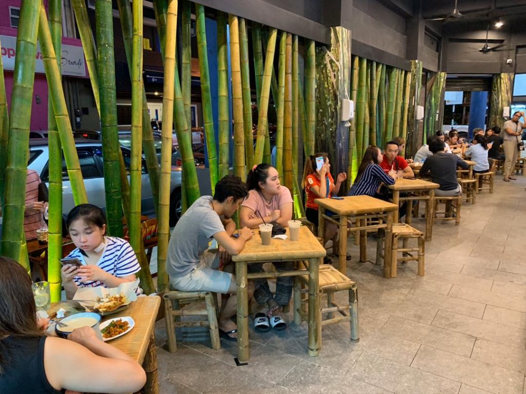 bamboo customer enjoying food Nasi Lemak Bamboo Exquisite Flavors