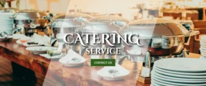 Professional catering buffet setup with chafing dishes, warming trays, and elegant food service equipment